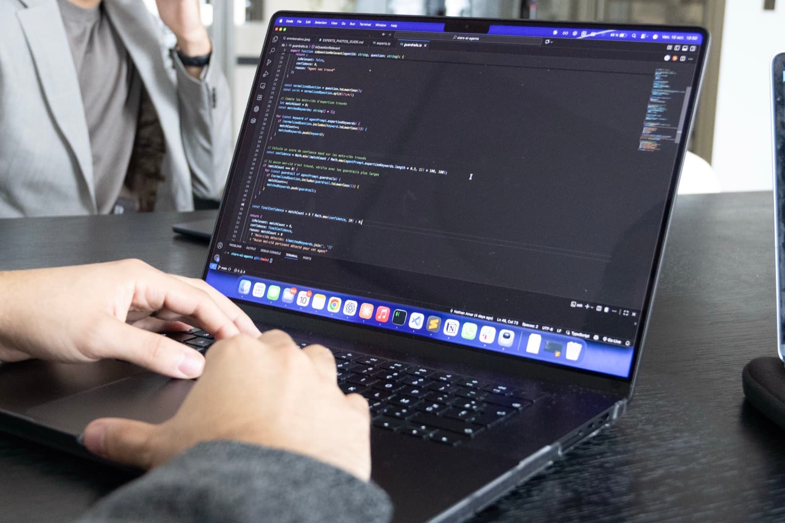 Code of an AI agent being written on a laptop